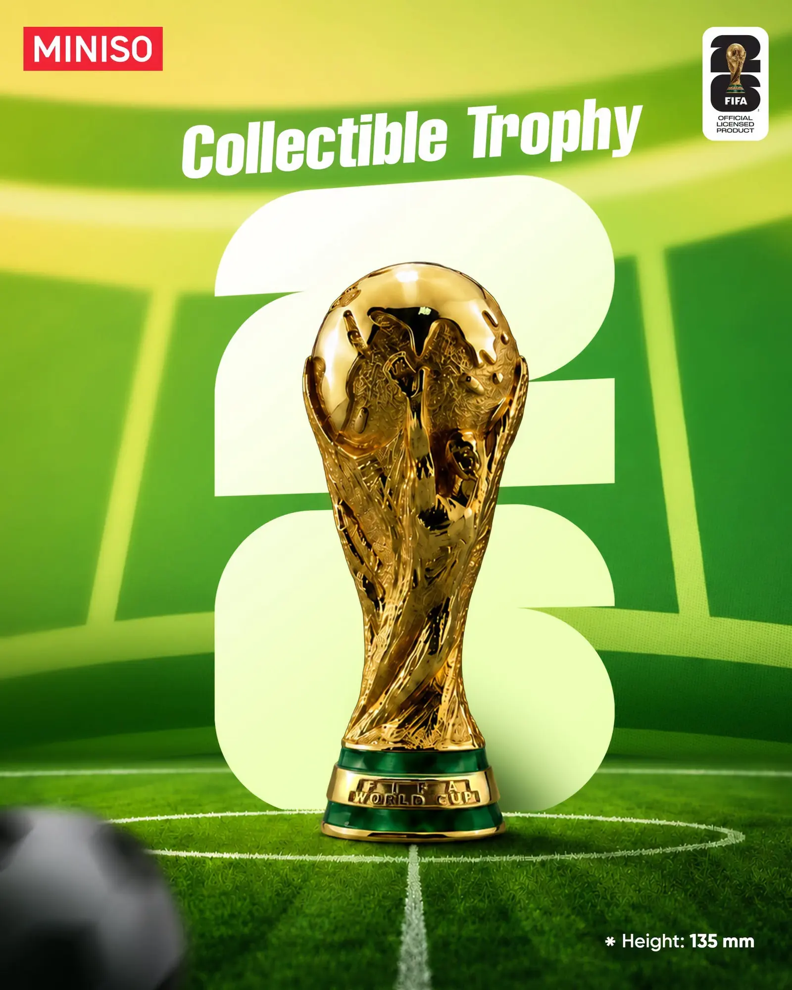 Collectible World Cup trophy shot on a green pitch with the height called out