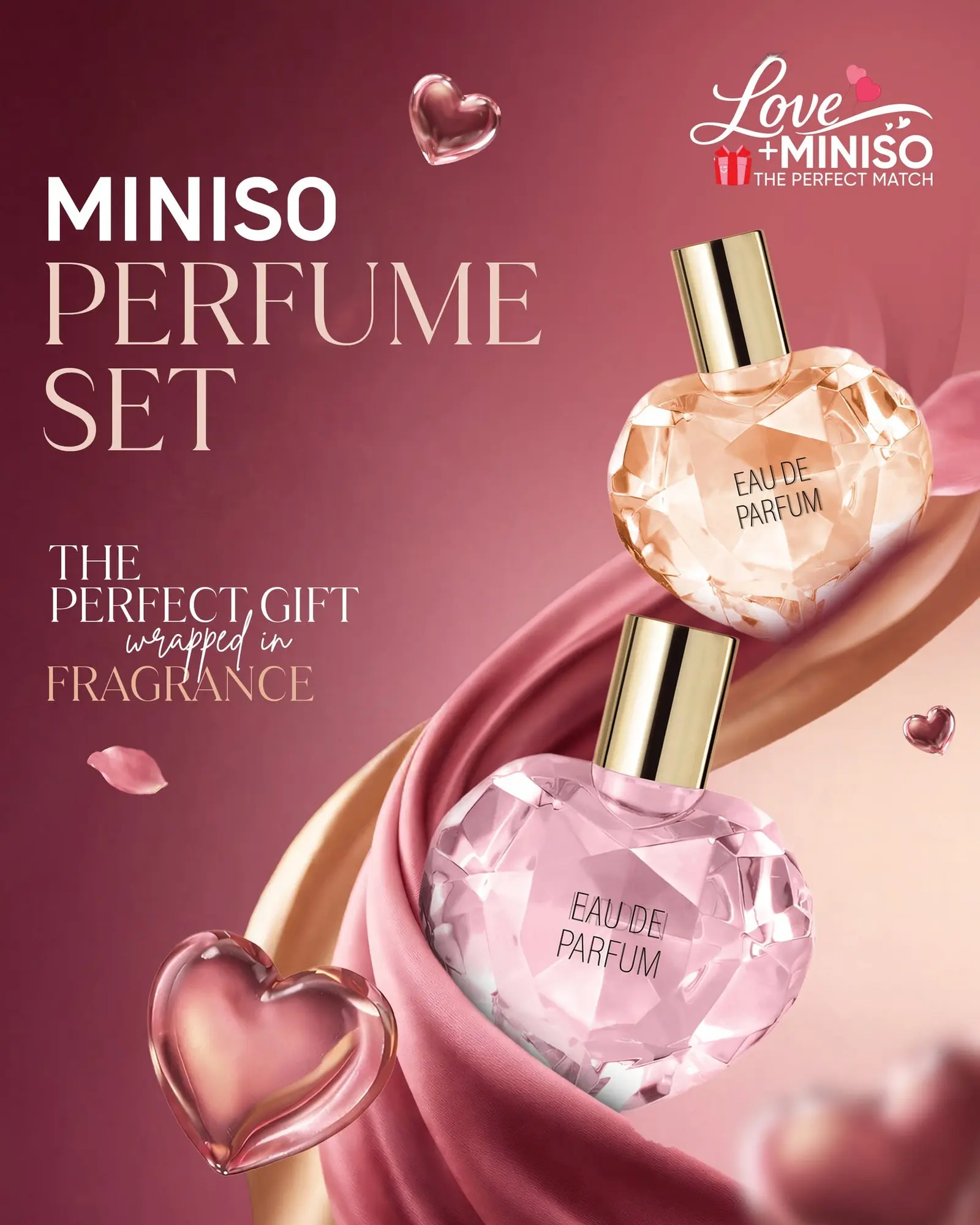 Valentine's perfume set styled on a soft pink ground with hearts